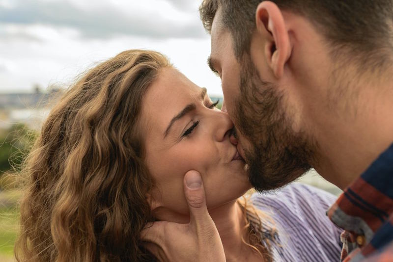 Couple sharing a close kiss after resolving tension and reconnecting emotionally